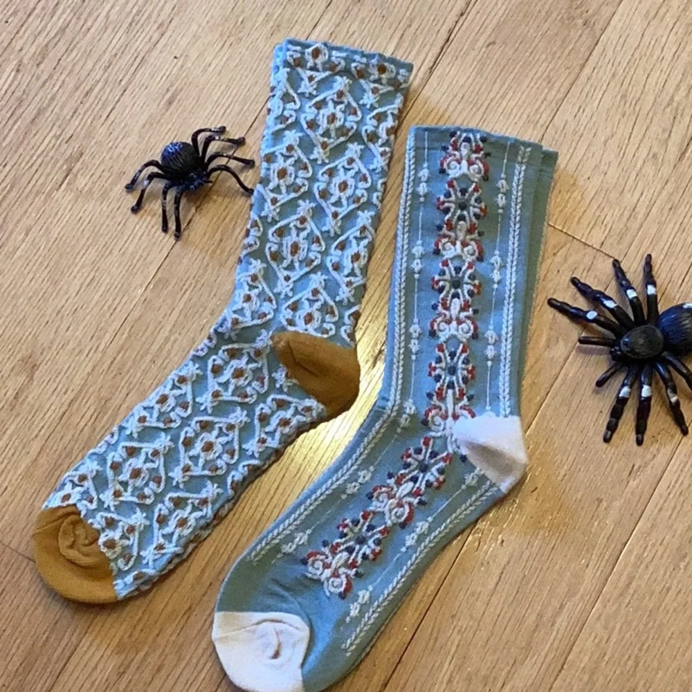 BUY 1 GET 1 2 pair of delicate looking adult socks for fall and fun. Brand new.